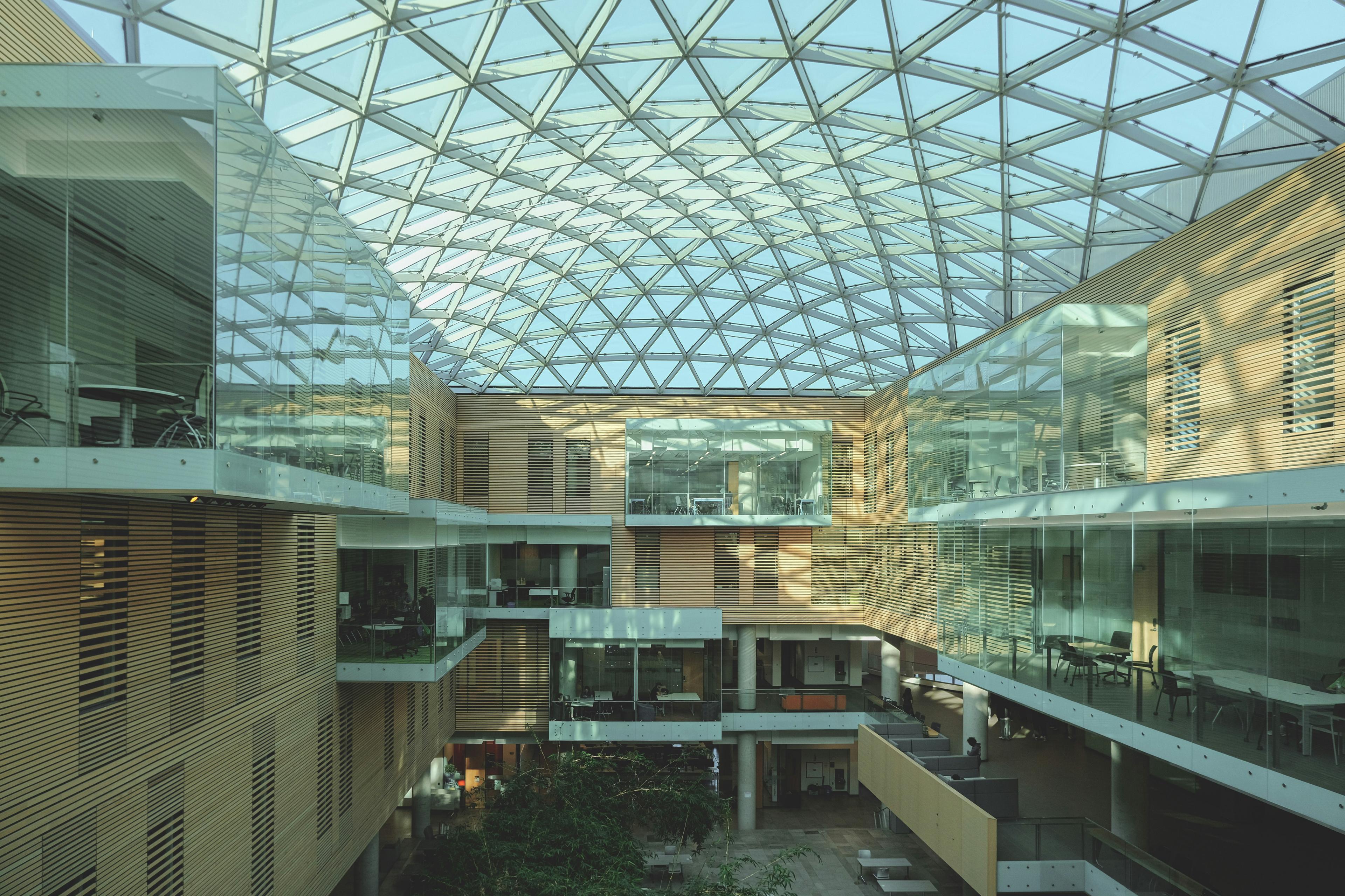 A bright, modern building with a glass ceiling.